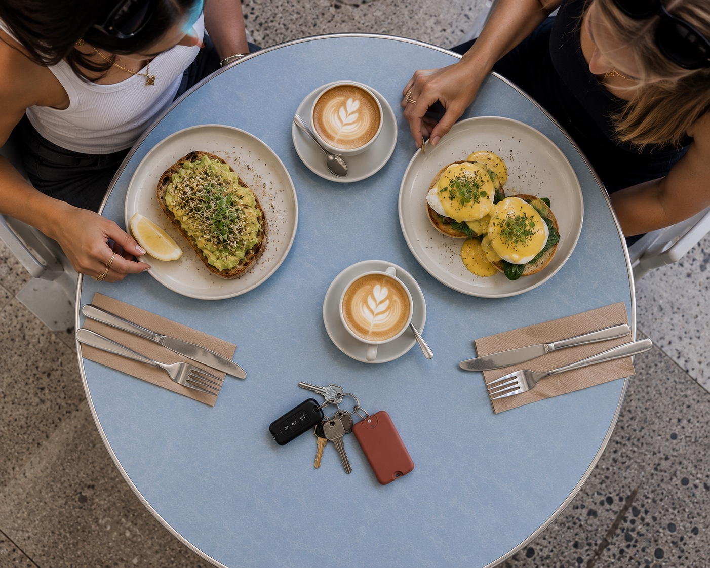 Pocket Mist on a café table between coffees and brunch plates